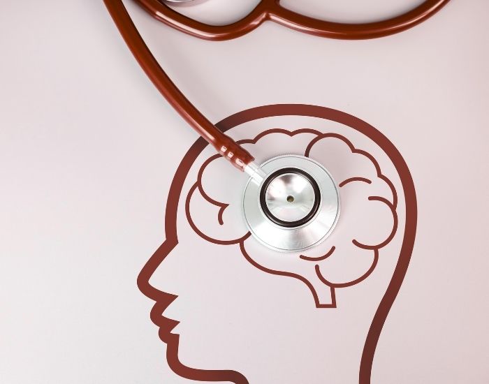Red yield sign with an exclamation point amid a rainy sky background.